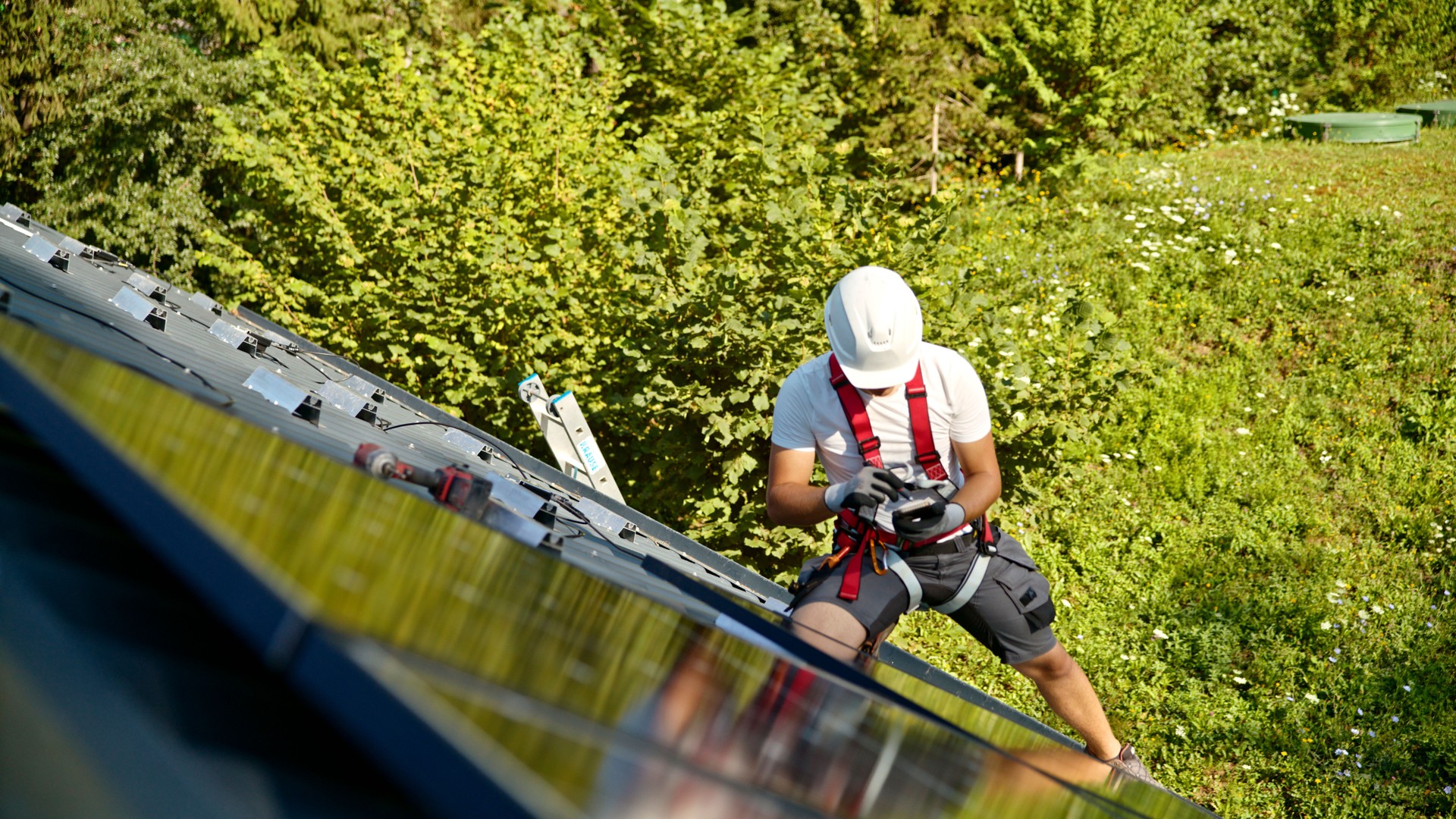 Caucasian Technicians Install Solar Panels on Rooftop